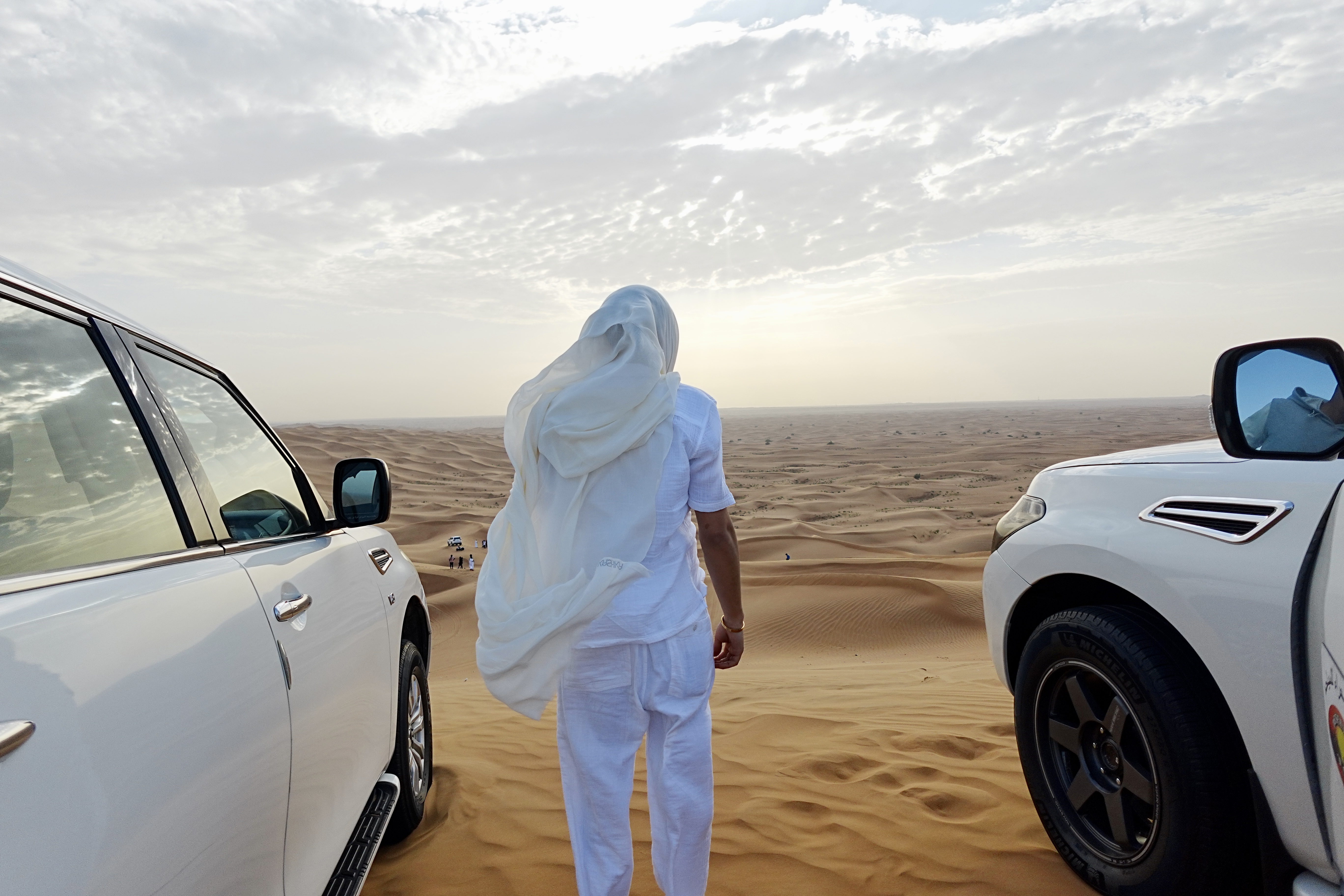 Edited photograph of a figure looking over the Dubai desert